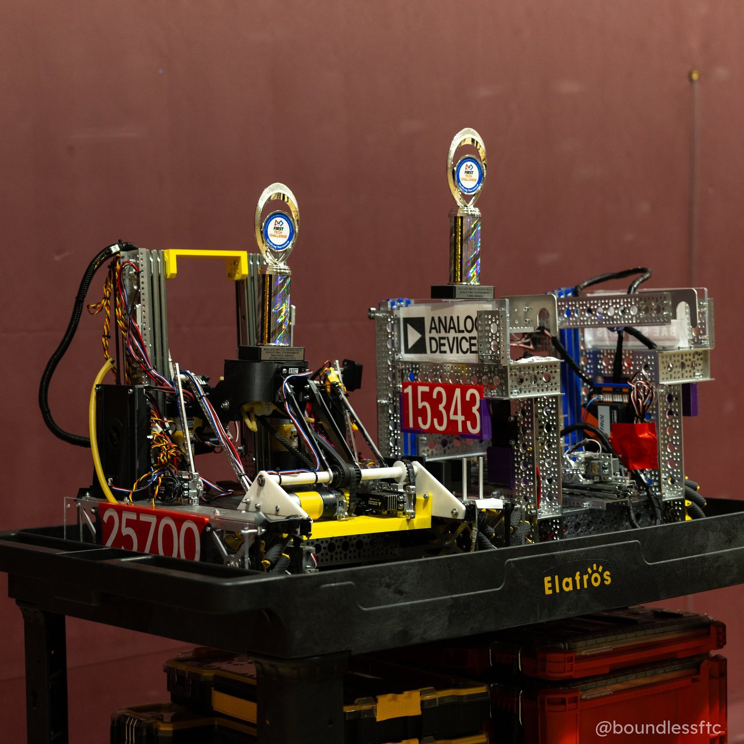 Two robots with trophies at Derryfield