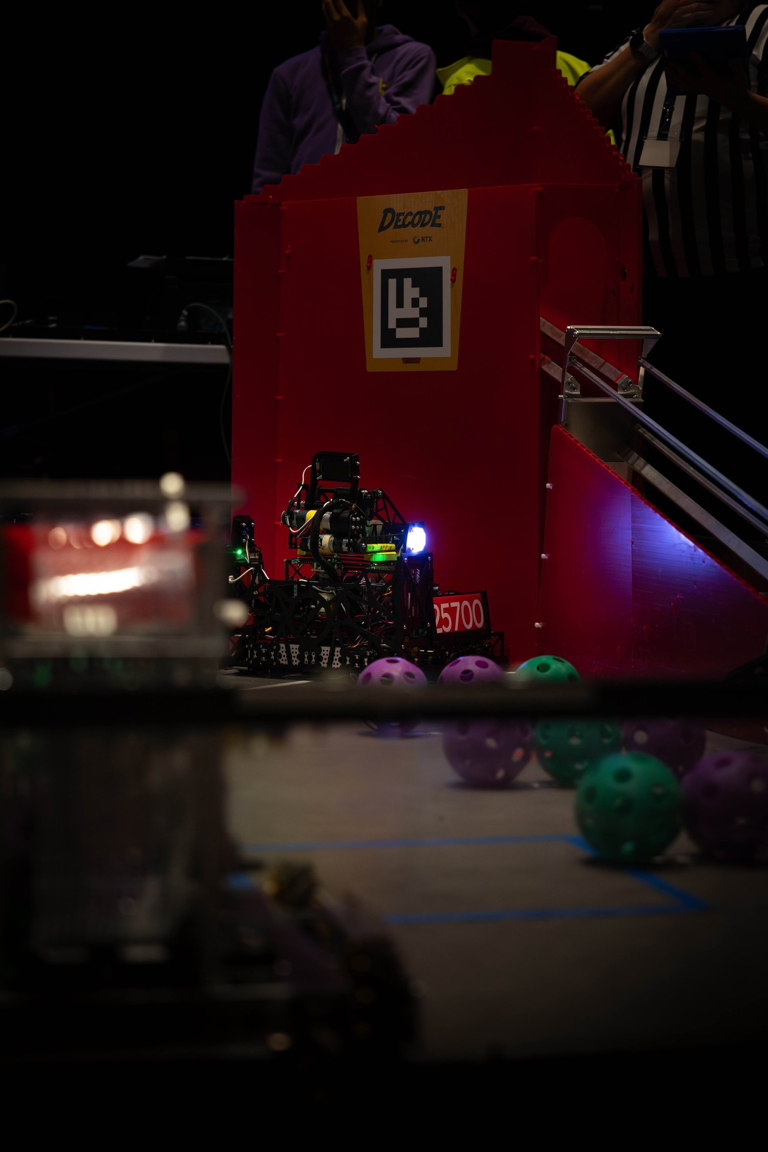 Robot under dark arena lights