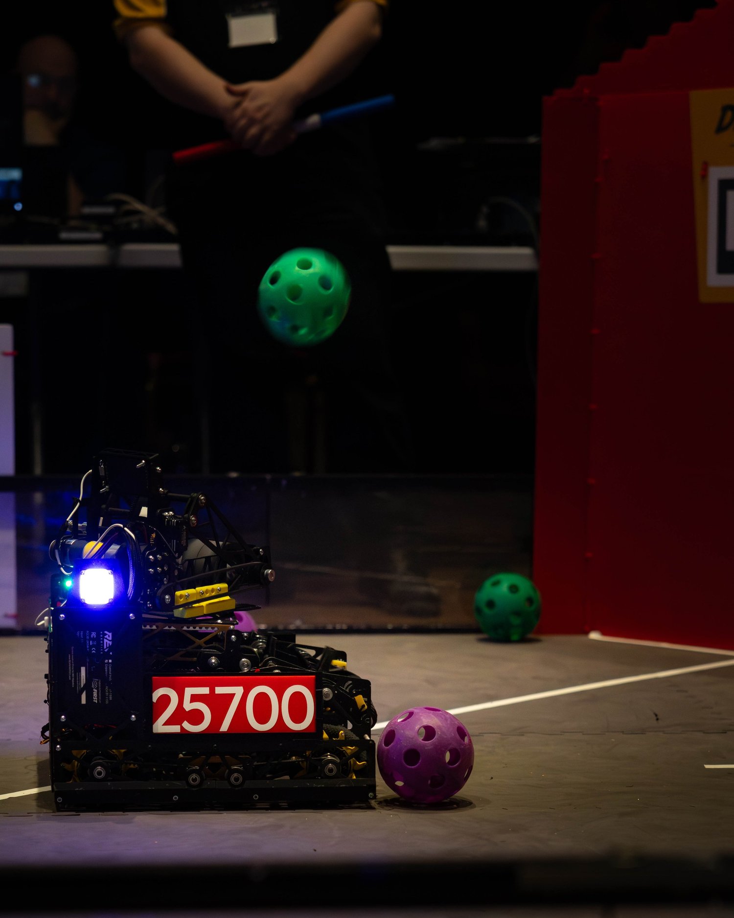 Bubu launching a ball mid-match